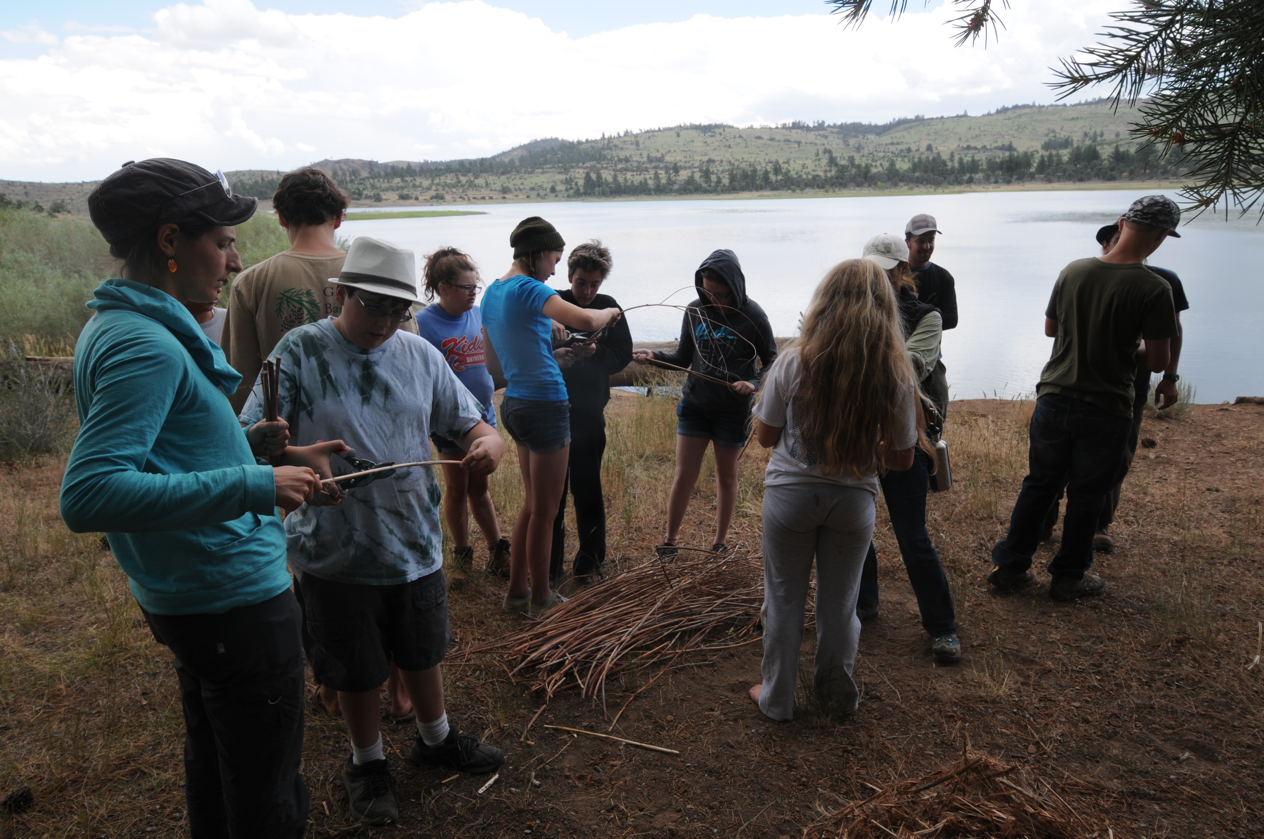 Campers at the shore of Indian Creek Reservior preparing to make bee nests.JPG