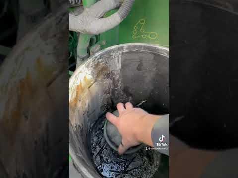 Changing the oil on a John Deere S670 Combine