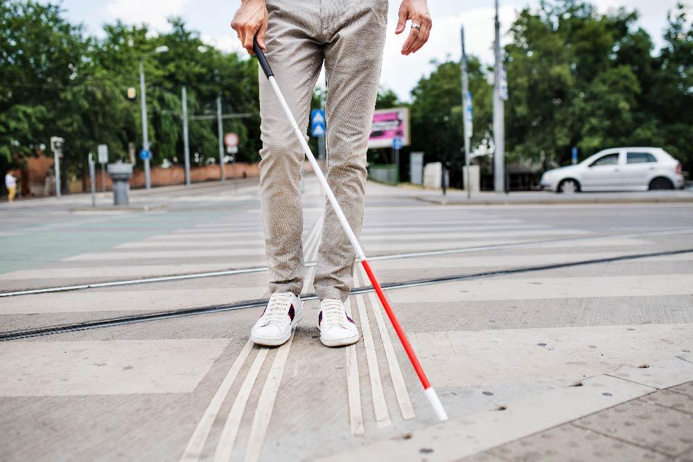 Young-blind-man-with-white-cane.jpg