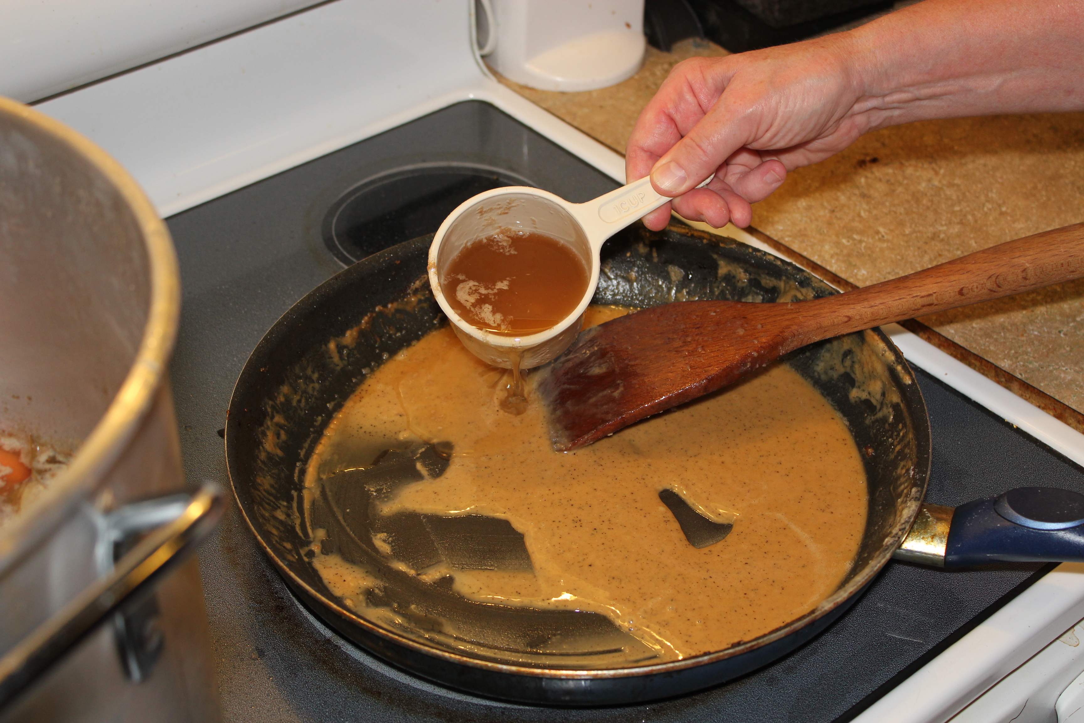 add the broth to the roux slowly (1).JPG