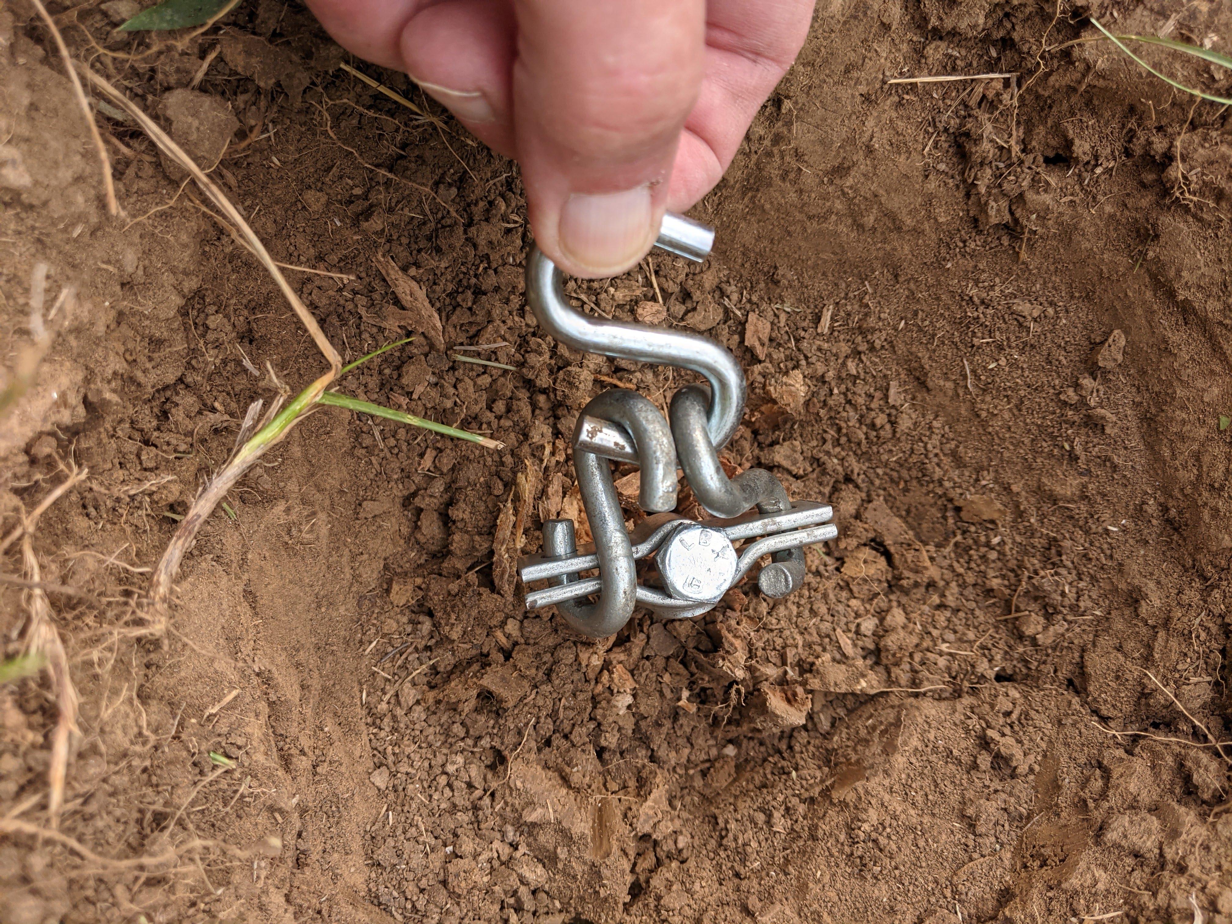 closeup of hooks attached to screw in post before pulling.jpg