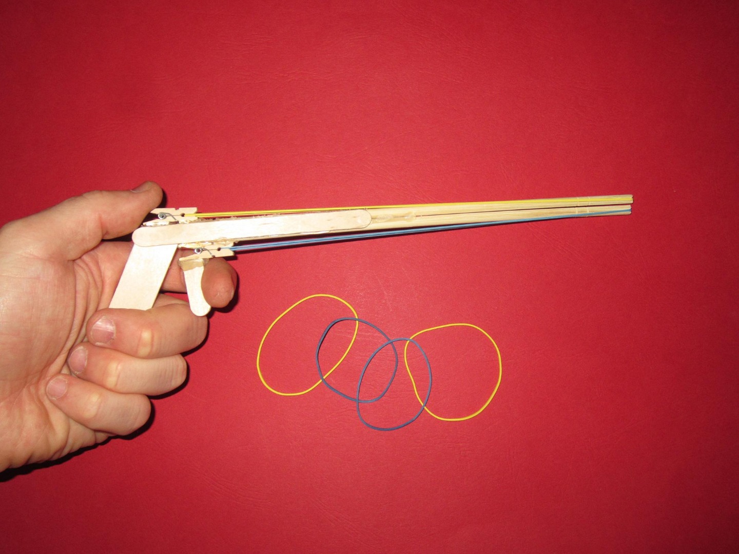 how to make a rubber band gun using popsicle sticks.JPG