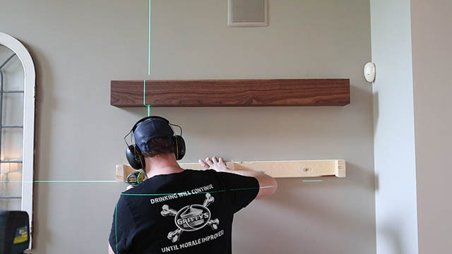 installing floating shelf I.jpg