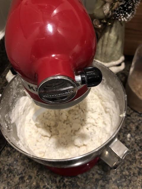 mixing dry ingredients with butter for snowball cookies.JPG